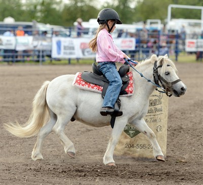 girl riding a pony